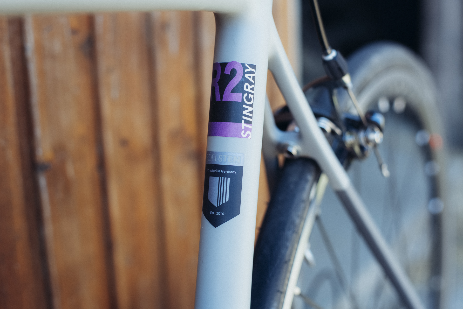 Close-up of an Edelsten carbon racing-bicycle frame and rear brake.